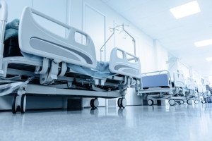 long corridor in hospital with surgical beds.