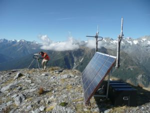 A GNS Science technician services a solar-powered GPS monitoring station at Gunn Ridge in Fiordland National Park. The instrument is one of  about 600 in the GeoNet nationwide network of instruments. Photo: GNS Science  