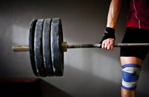 Man practising weightlifting III