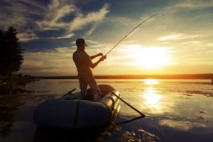 Fisherman in a pond