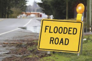 Outdoor Sign Stating Flooded Road