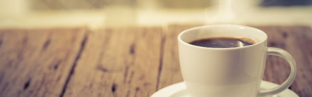 Coffee cup on a day window background